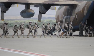 Soldiers boarding a combat aircraft